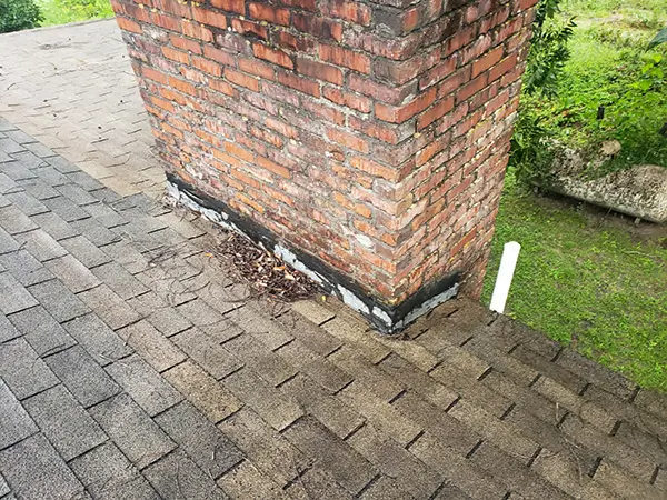 No chimney cricket/diverter in place
